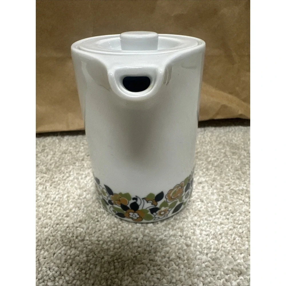 Vintage cream pitcher in the retro floral, manufactured by Suisse Langenthal